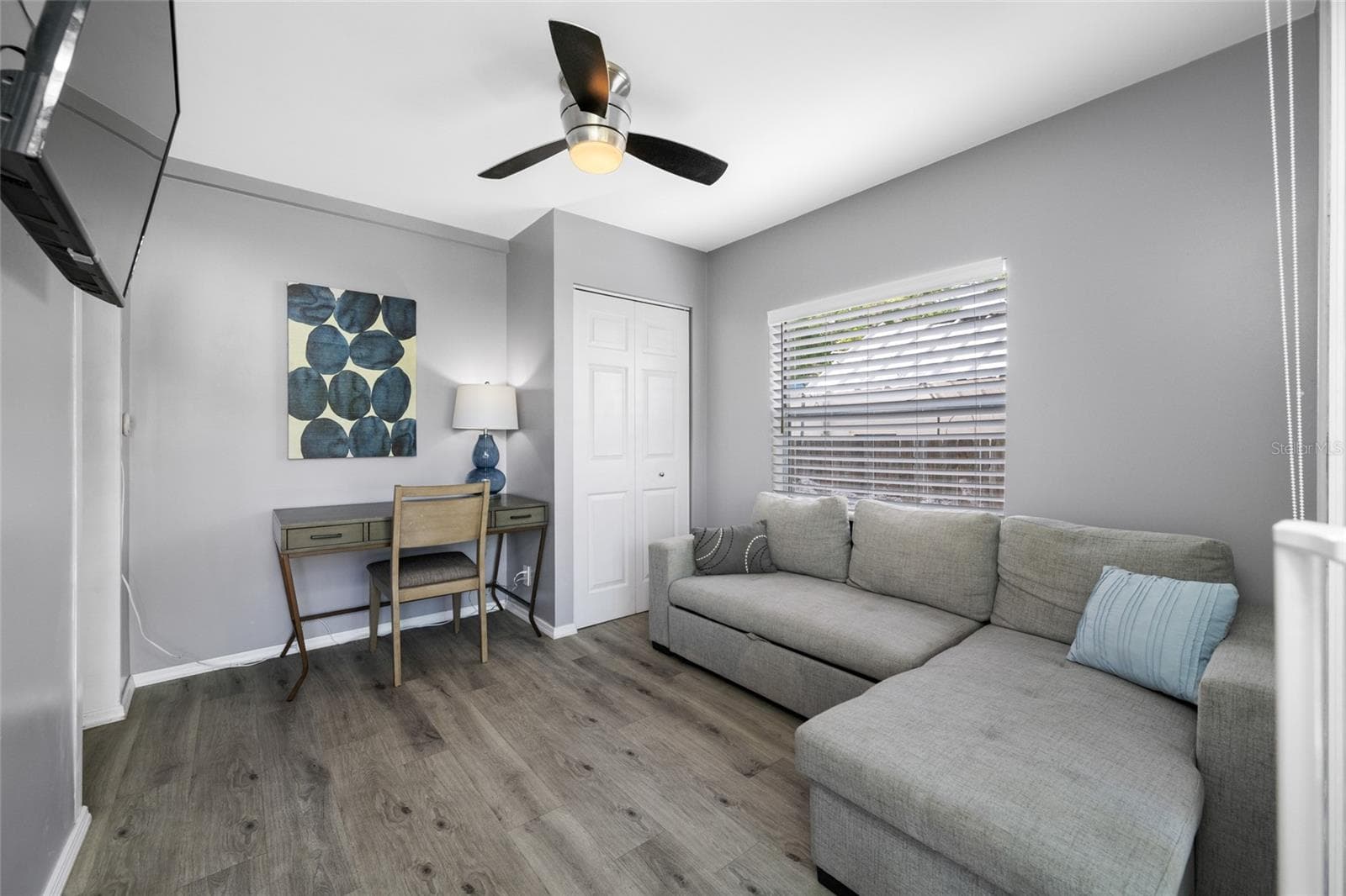 Bedroom 3 / Office with built in closet and slider opening to the back deck. - 5044 BETTY ST N, ST PETERSBURG