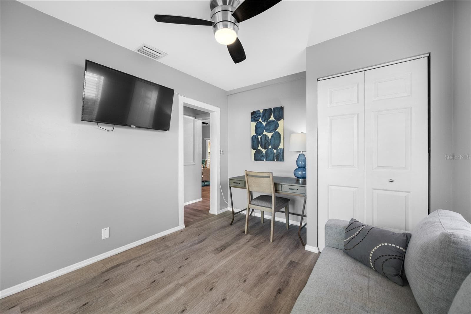 Bedroom 3 / Office with built in closet and slider opening to the back deck. - 5044 BETTY ST N, ST PETERSBURG