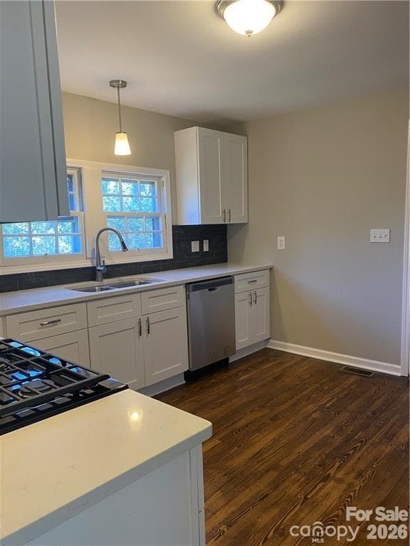 Kitchen that has a dishwasher, stackable washer and dryer and a fridge - 808 N Weldon Street, Gastonia