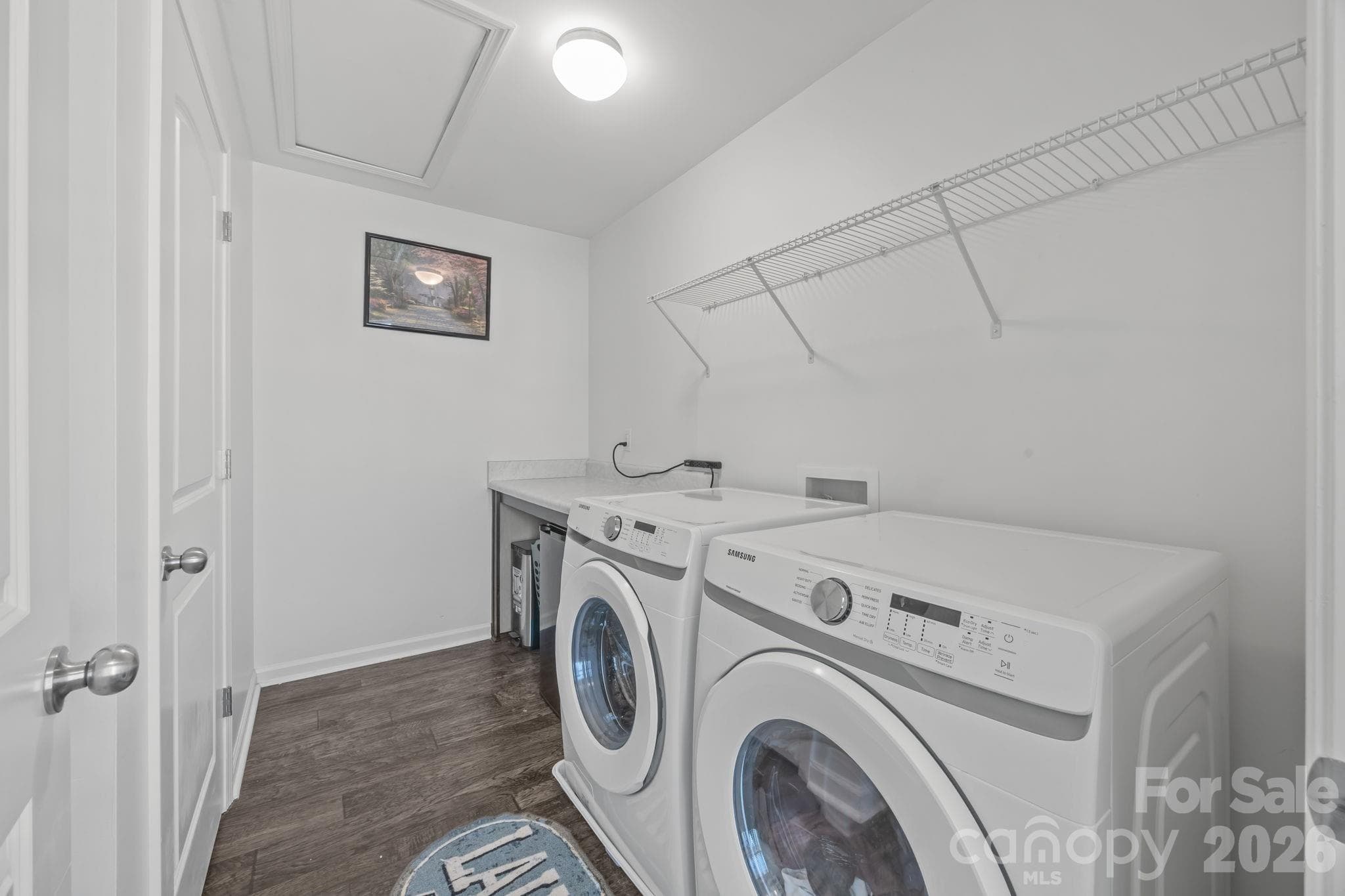 Laundry Room with closet and folding table - 813 Yorkshire Drive, Albemarle