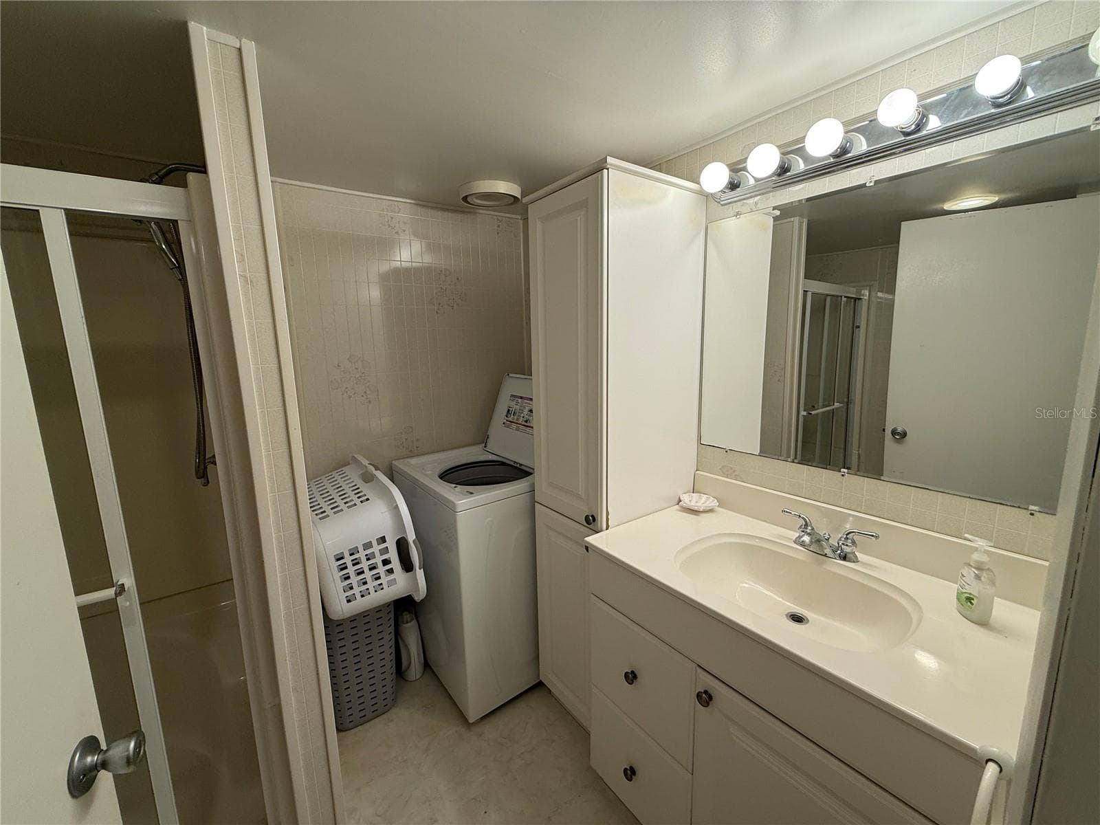 Washer in Bathroom - 12674 SEMINOLE BLVD #S18, LARGO
