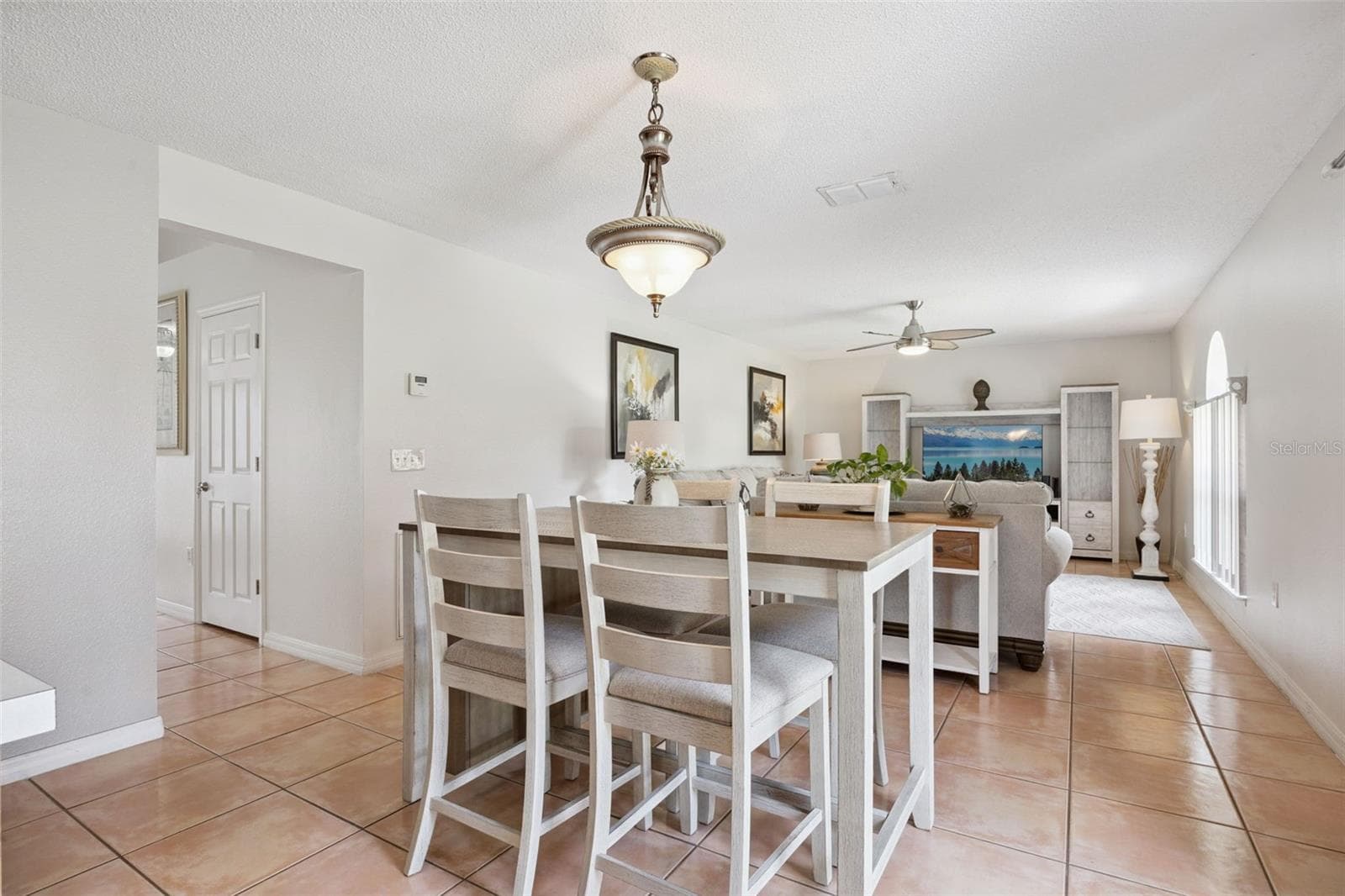 The Family room and kitchen are on the rear of the home with lots of natural light - 670 BROWN BEAR CT, ST CLOUD