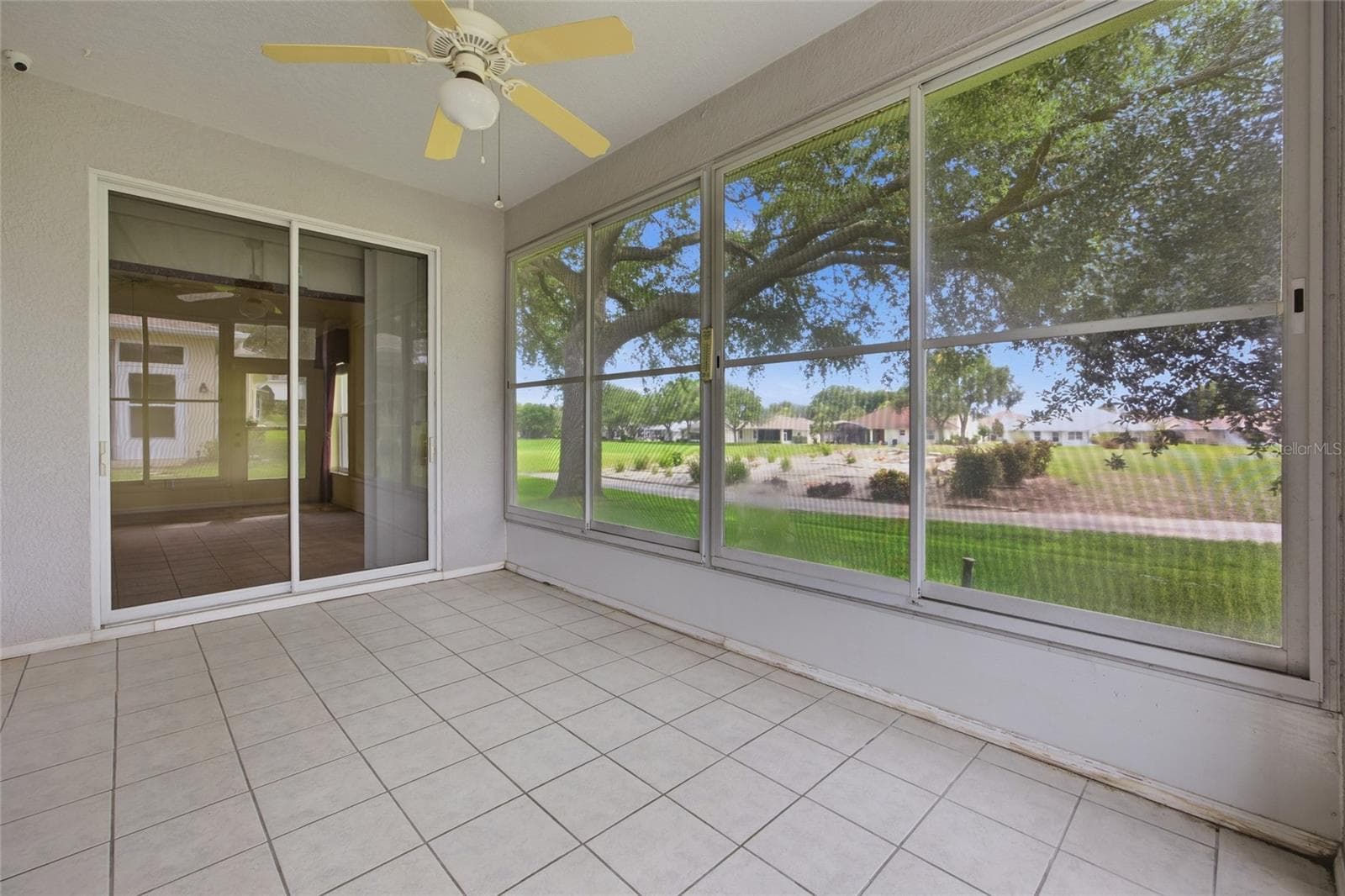 Lanai with windows on the 16th Tee box - 4905 KELSO ST, LEESBURG