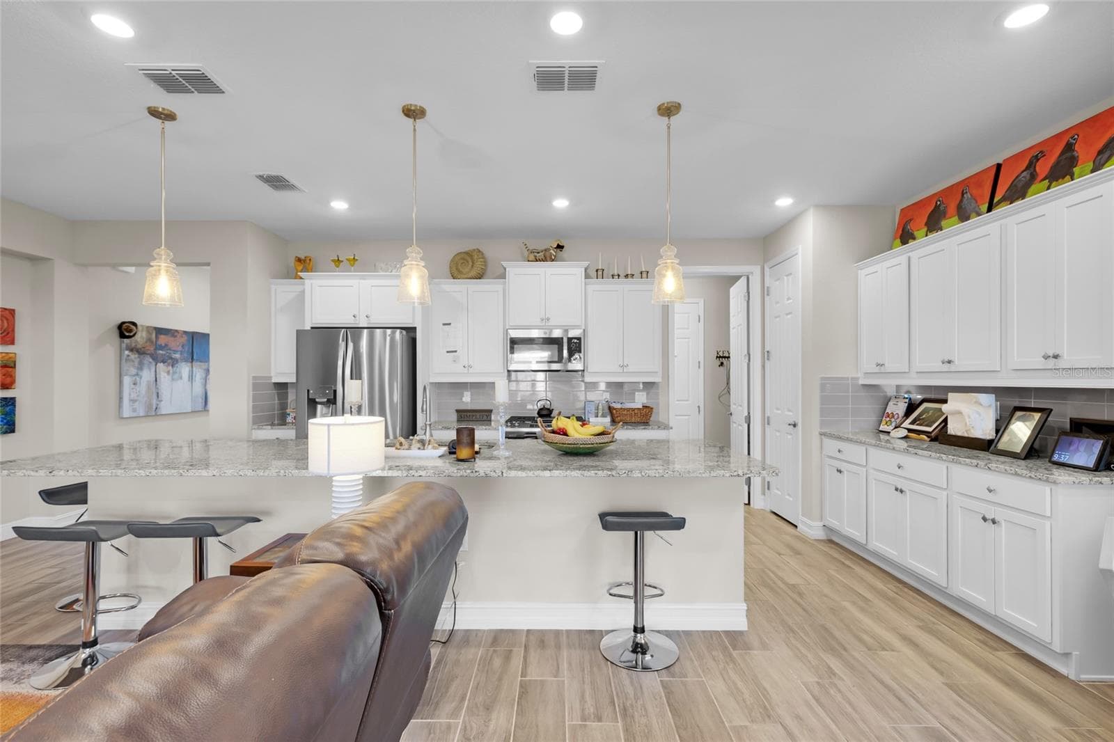 Living room facing kitchen - 4394 NW 54TH TER, OCALA