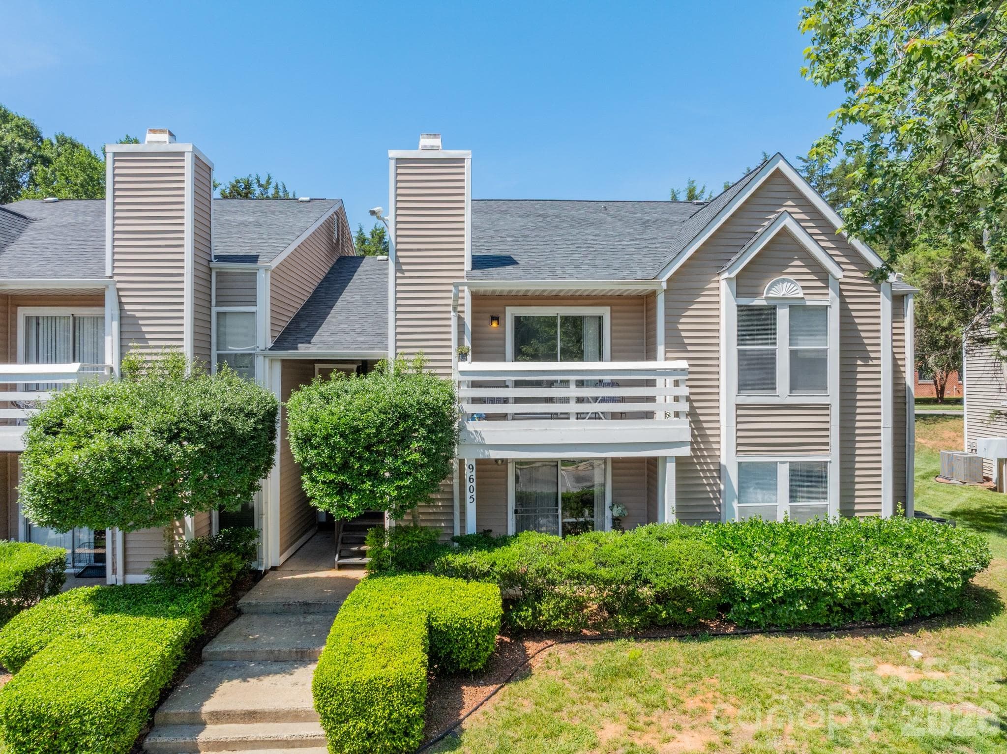 Building exterior and manicured lawn - Charlotte