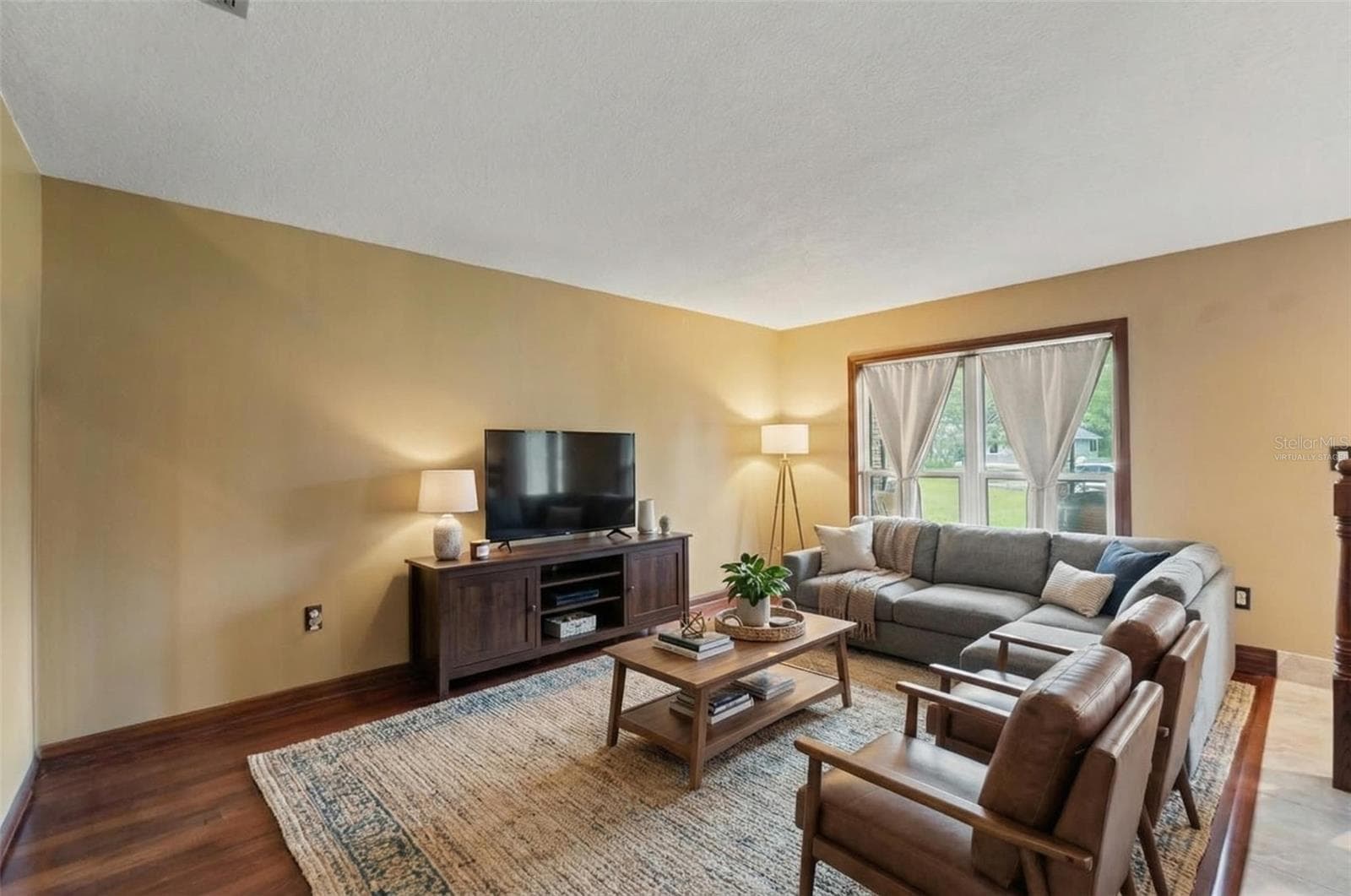 formal living room primary residence.Virtually Staged - 1357 DINSMORE CT, NEW PORT RICHEY