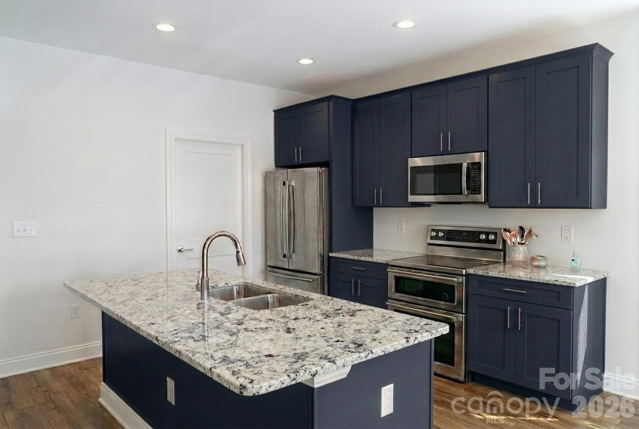 Kitchen rendering showing lots of cabinetry and granite countertops - Canton