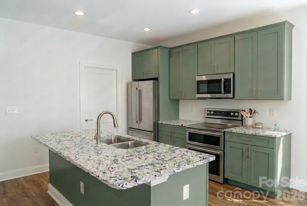 Well equipt kitchen rendering with lots of cabinets and granite countertops - Canton