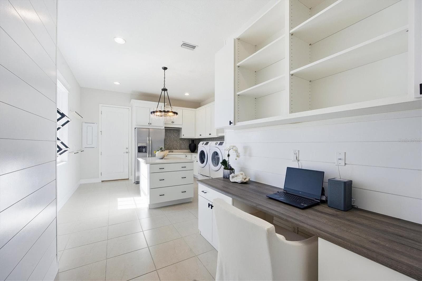 Multi-purpose Utility Room has Washer and Dryer, Extra Full Sized Refrigerator, Built-ins including Desk and Shelving - 3467 COMPOUND CT, SARASOTA