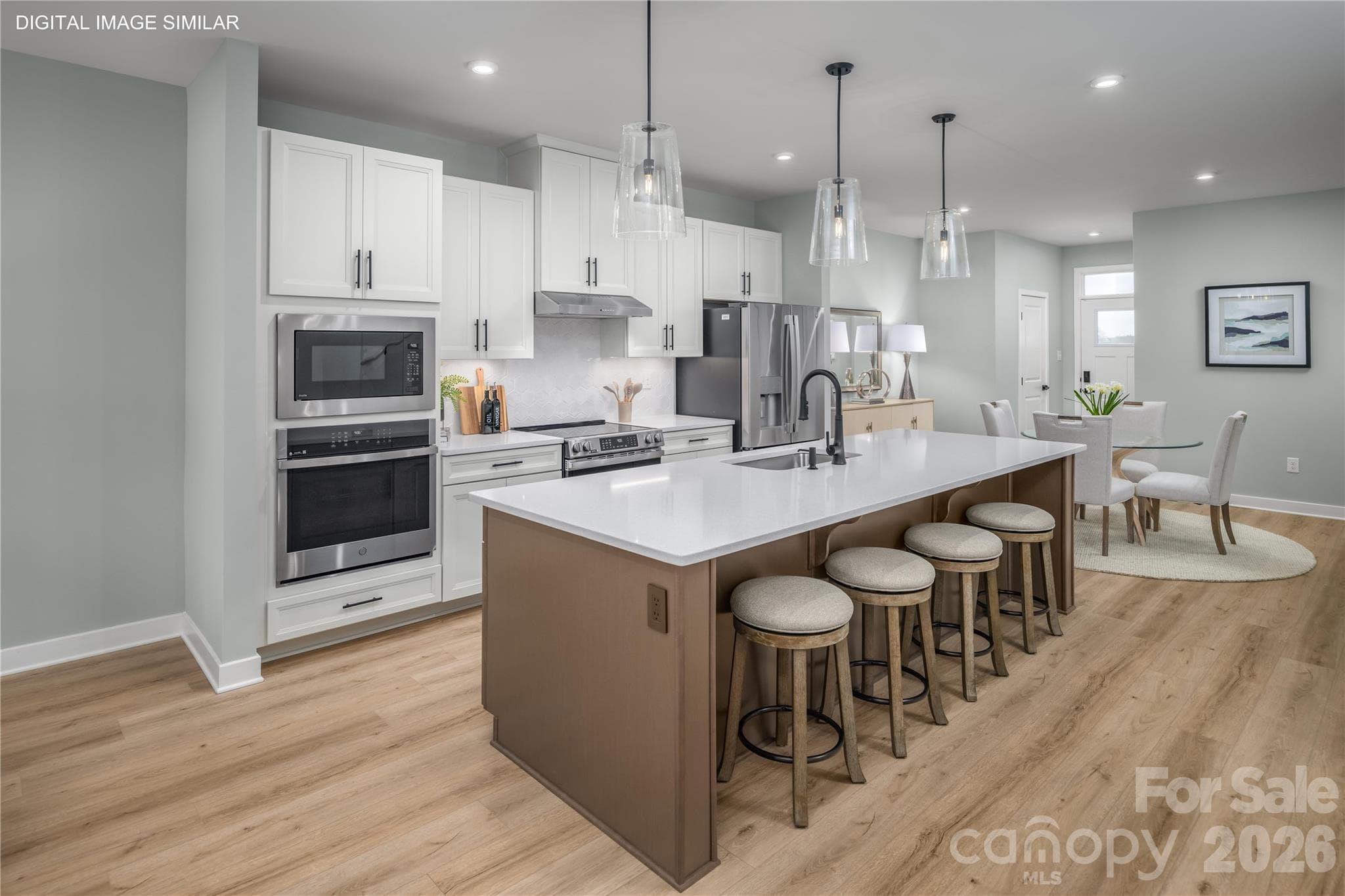 Bright, open kitchen with generous prep space and a large center island. - 11138 Emerson Landing Drive, Charlotte