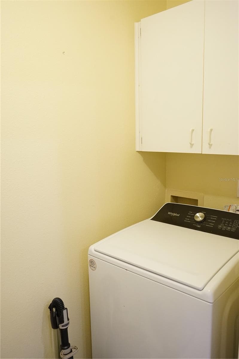 storage cabinet above washer - 652 MC DANIEL ST, SUN CITY CENTER