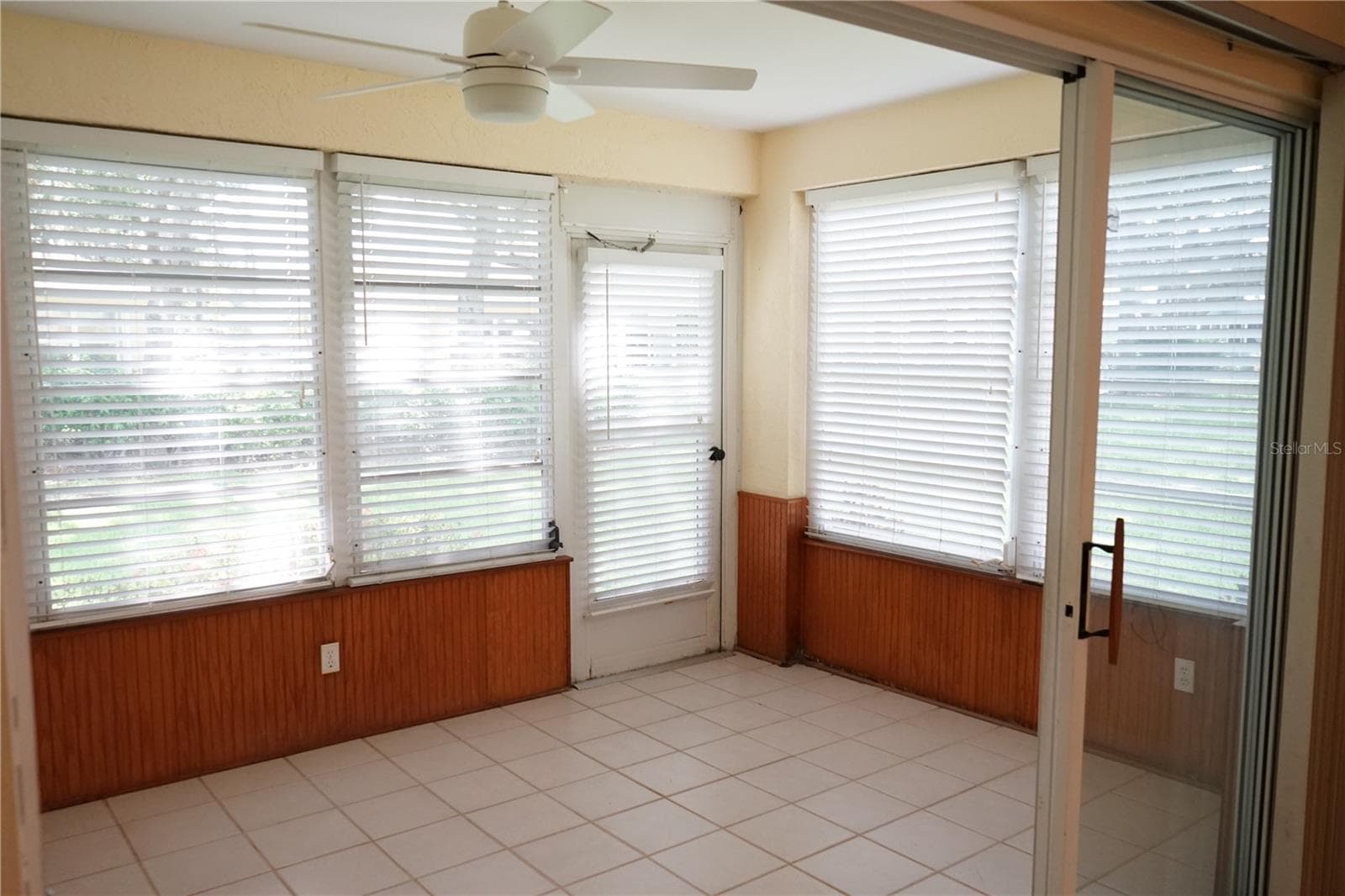 lanai with door to outside - 652 MC DANIEL ST, SUN CITY CENTER