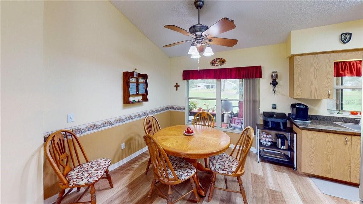 Dining area conveniently located adjacent to the kitchen and living room. - 267 N ORANGE AVE, LAKE HELEN