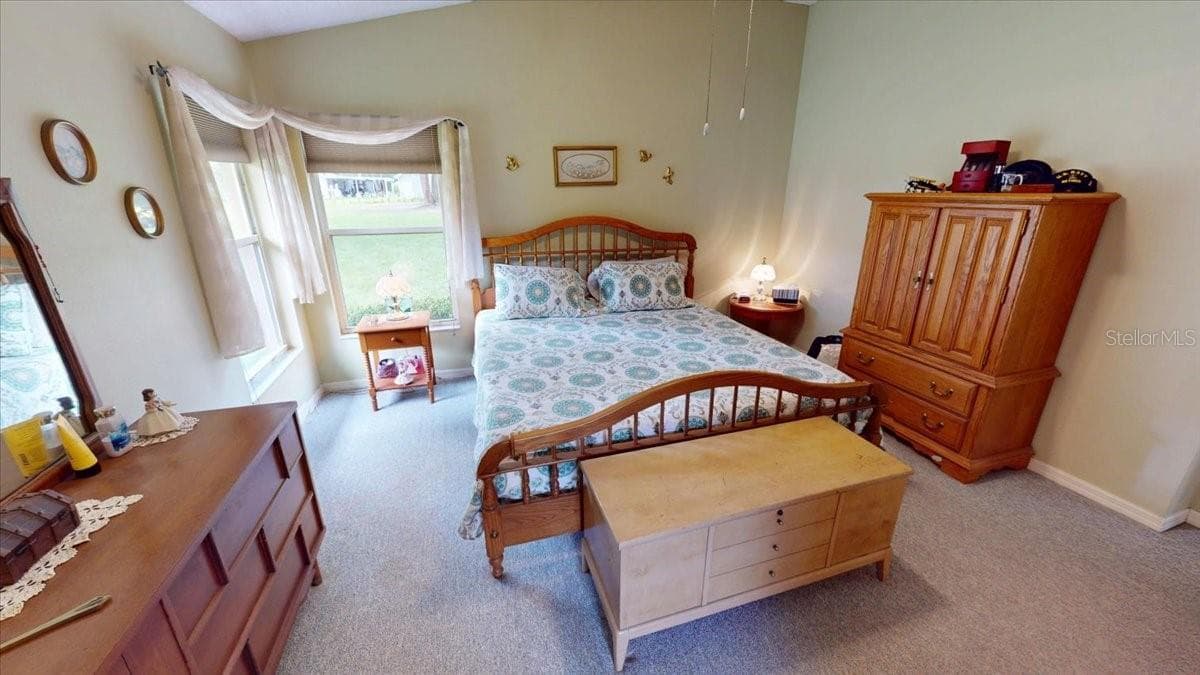 Primary bedroom with natural light and spacious layout. - 267 N ORANGE AVE, LAKE HELEN