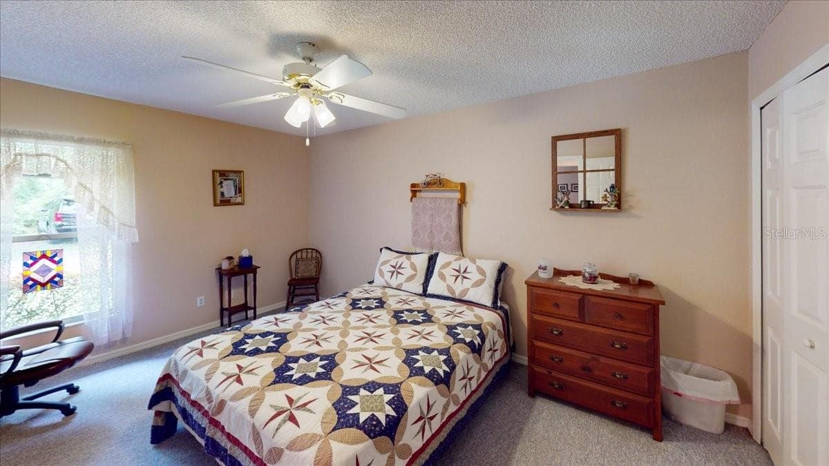 Secondary bedroom with comfortable layout and natural lighting. - 267 N ORANGE AVE, LAKE HELEN