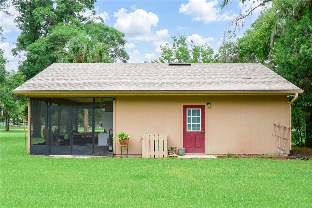 Rear exterior of guest house showcasing separate living accommodations. - 267 N ORANGE AVE, LAKE HELEN