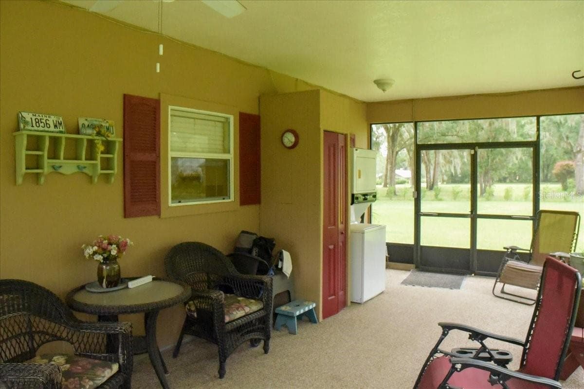 Guest house Screened porch with laundry - washer/dryer combo conveys with the home. - 267 N ORANGE AVE, LAKE HELEN
