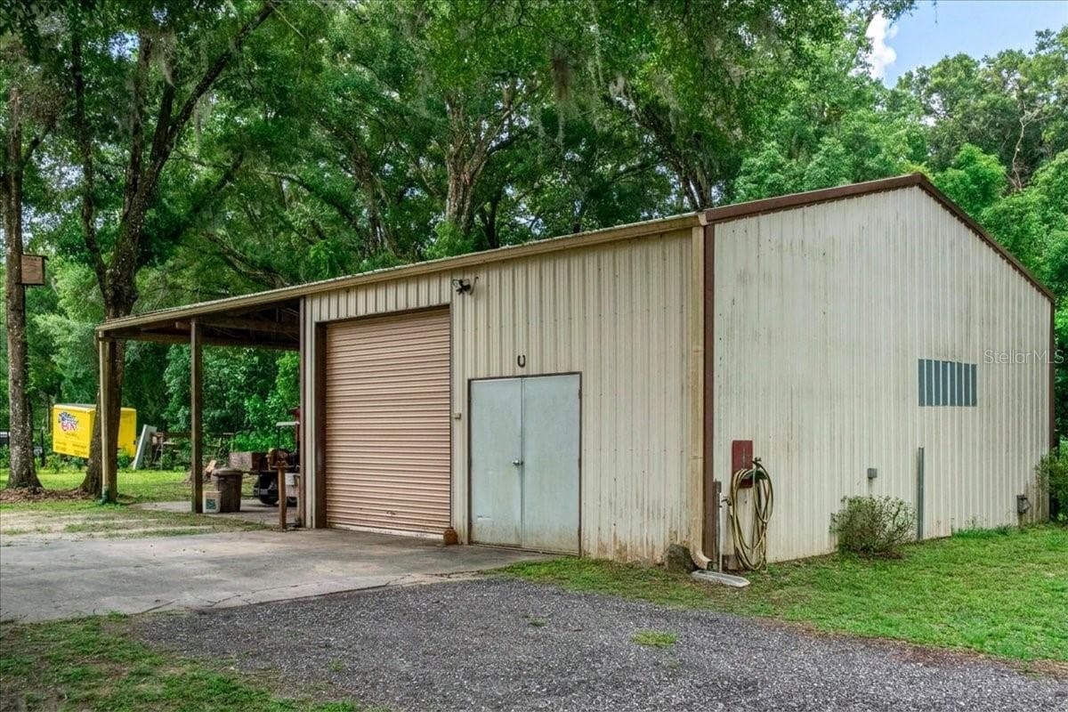 Detached garage and workshop offering Electrical, Water with additional storage and workspace. - 267 N ORANGE AVE, LAKE HELEN