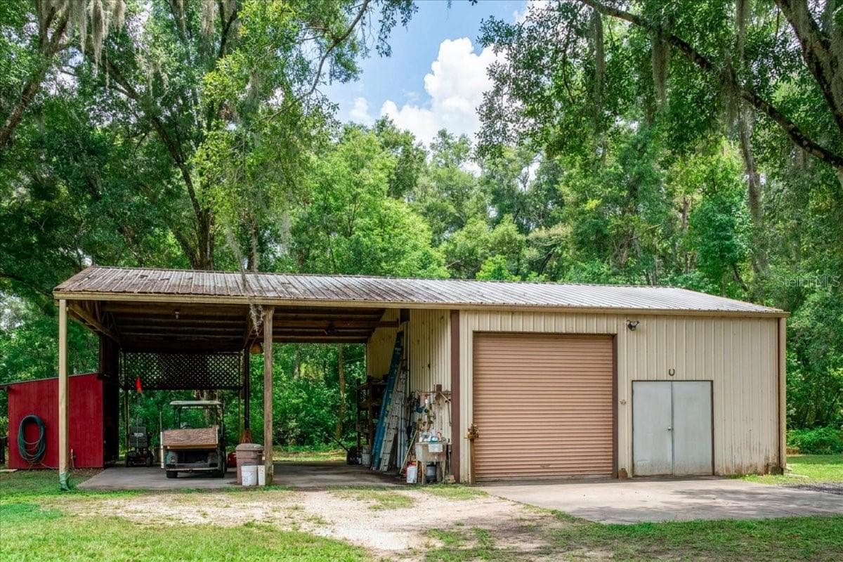 Detached workshop and garage building with RV, BOAT or covered equipment storage area. - 267 N ORANGE AVE, LAKE HELEN
