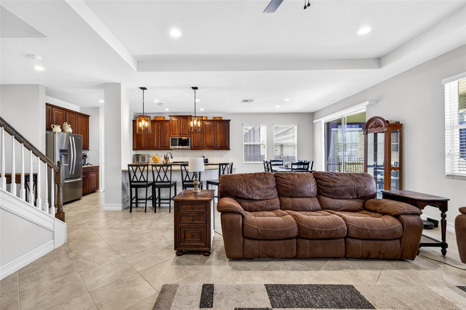 Living room is a semi-open floor plan with a dedicated dining area. - 7109 BAY LAUREL CT, WESLEY CHAPEL