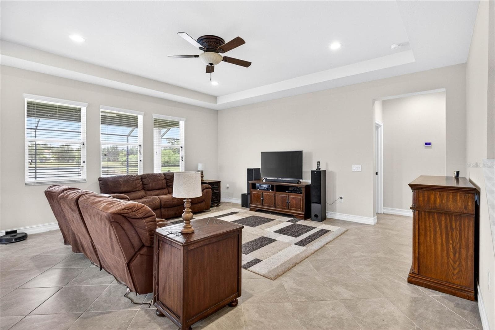 Living room fits large sectional. - 7109 BAY LAUREL CT, WESLEY CHAPEL