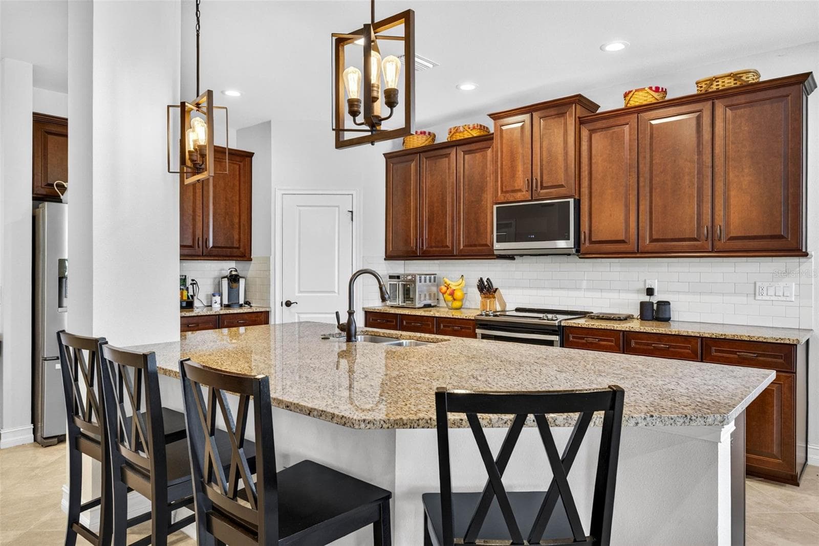 Granite countertops throughout. - 7109 BAY LAUREL CT, WESLEY CHAPEL
