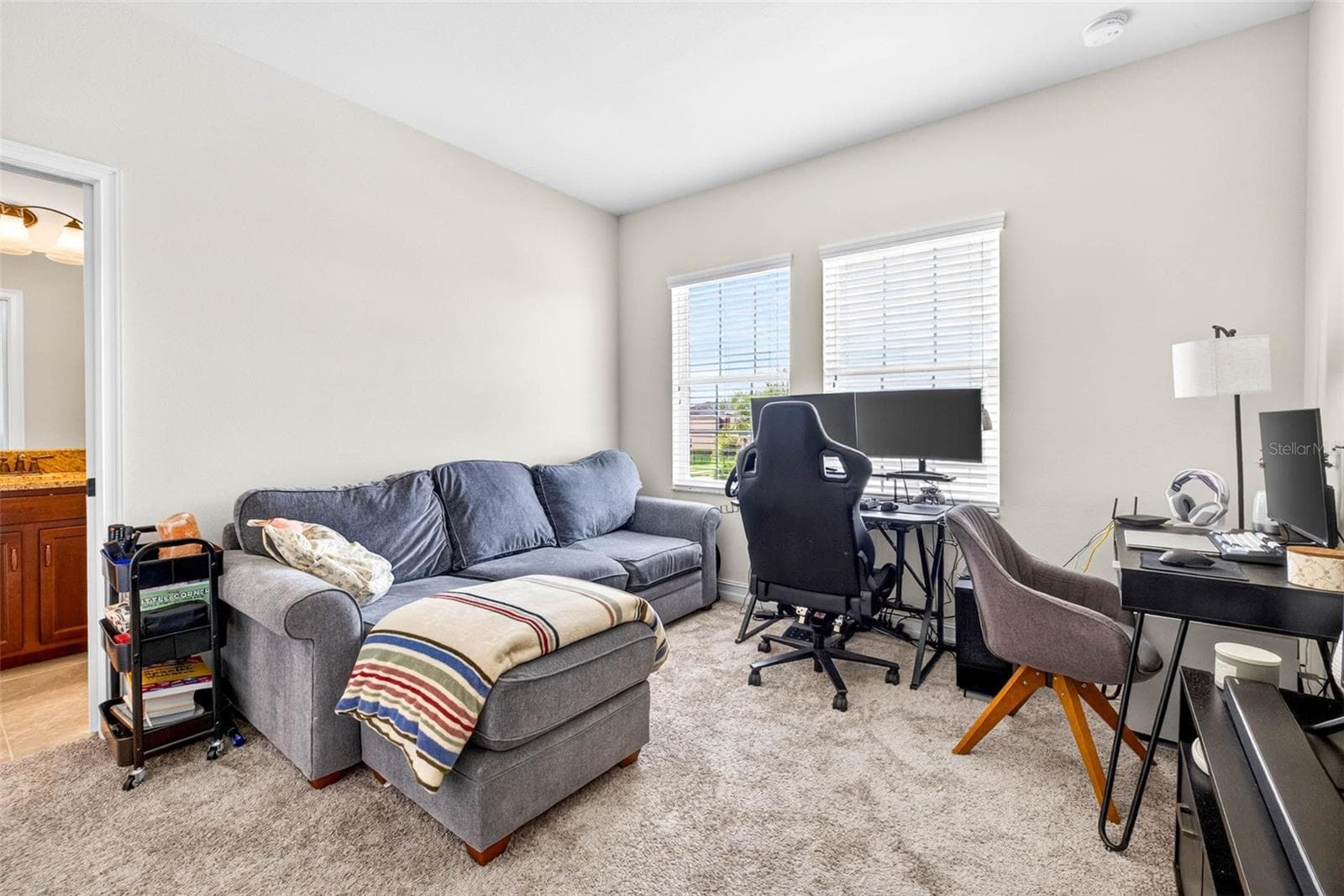 Bedroom 4 second floor currently used as a work/study room. - 7109 BAY LAUREL CT, WESLEY CHAPEL