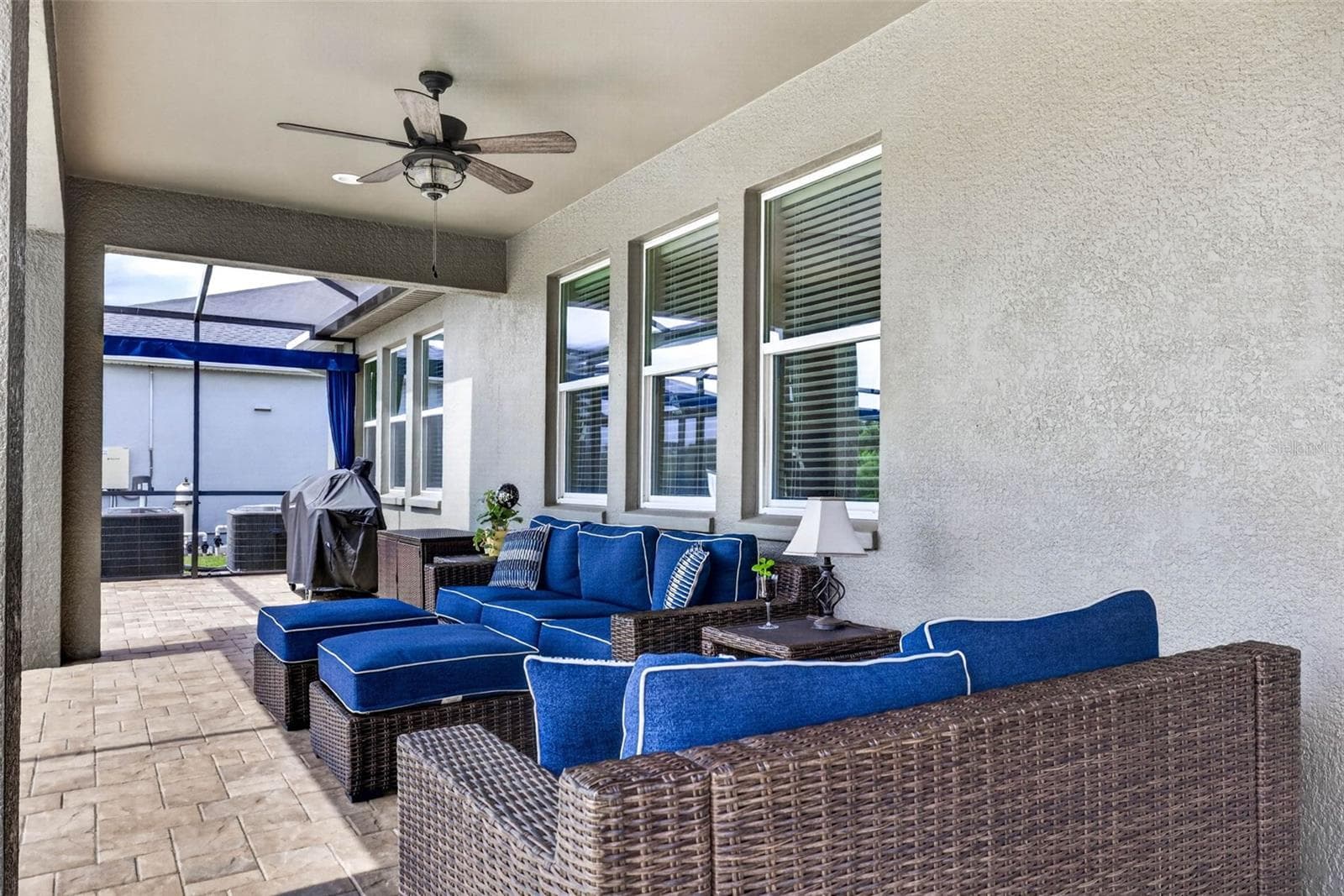 Seating area with outdoor fan. - 7109 BAY LAUREL CT, WESLEY CHAPEL