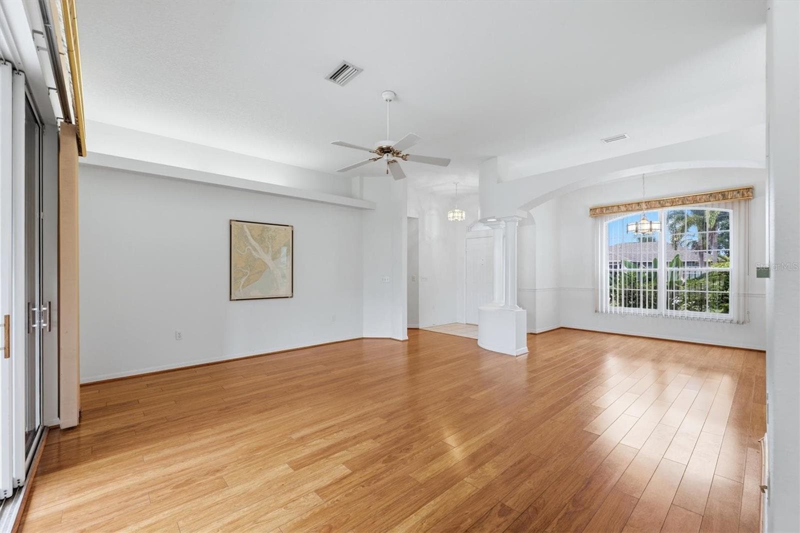 Living/dining room has wood-look laminate flooring - 2404 50TH DR E, BRADENTON