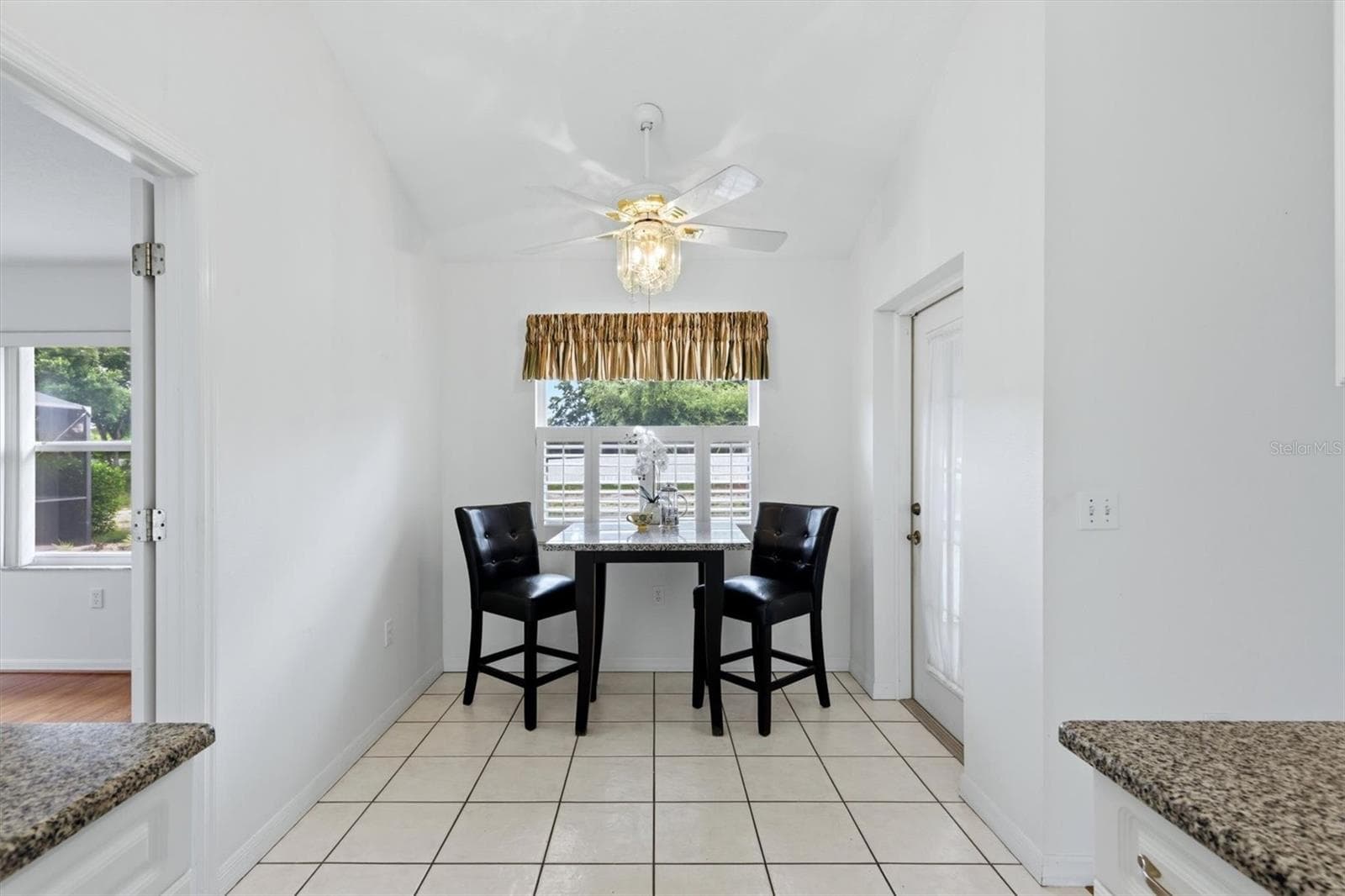 Breakfast nook with French door to lanai - 2404 50TH DR E, BRADENTON