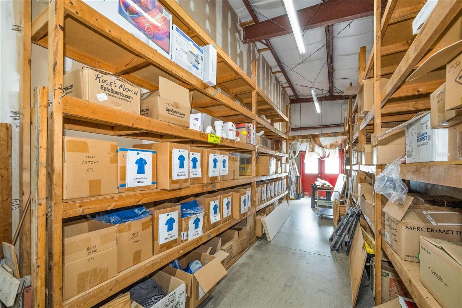 Warehouse storage area with entry doors on the north end. - 6581 SEMINOLE BLVD, SEMINOLE