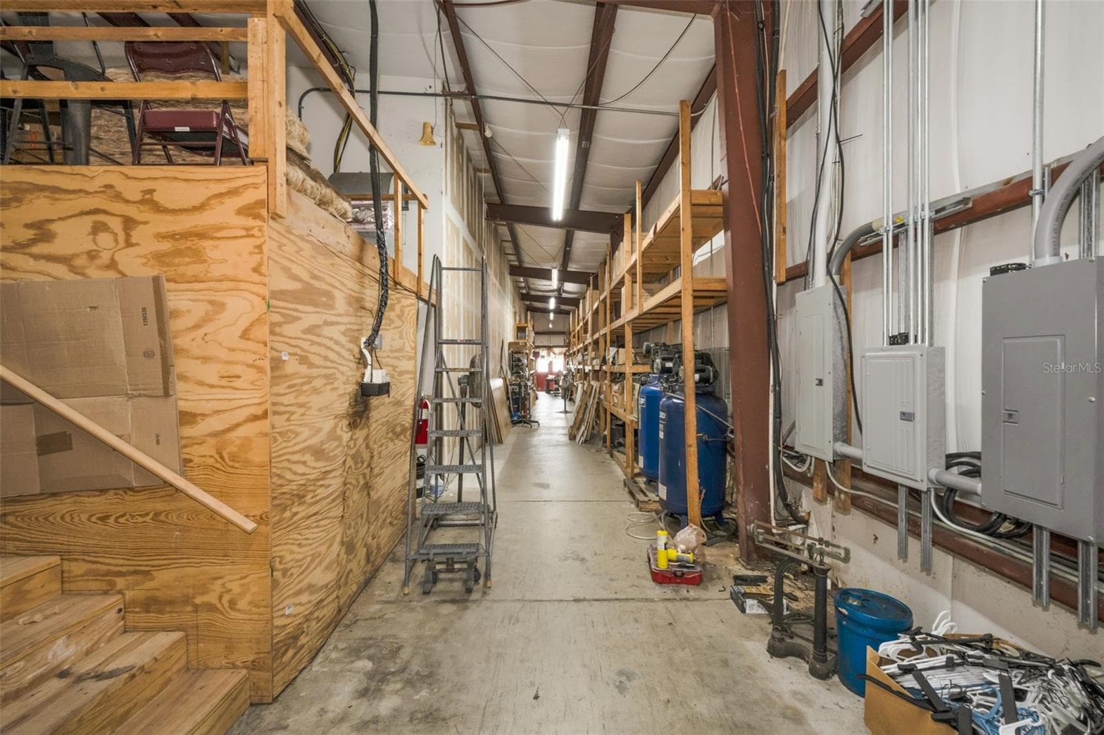 Warehouse storage area and access to mezzanine. - 6581 SEMINOLE BLVD, SEMINOLE
