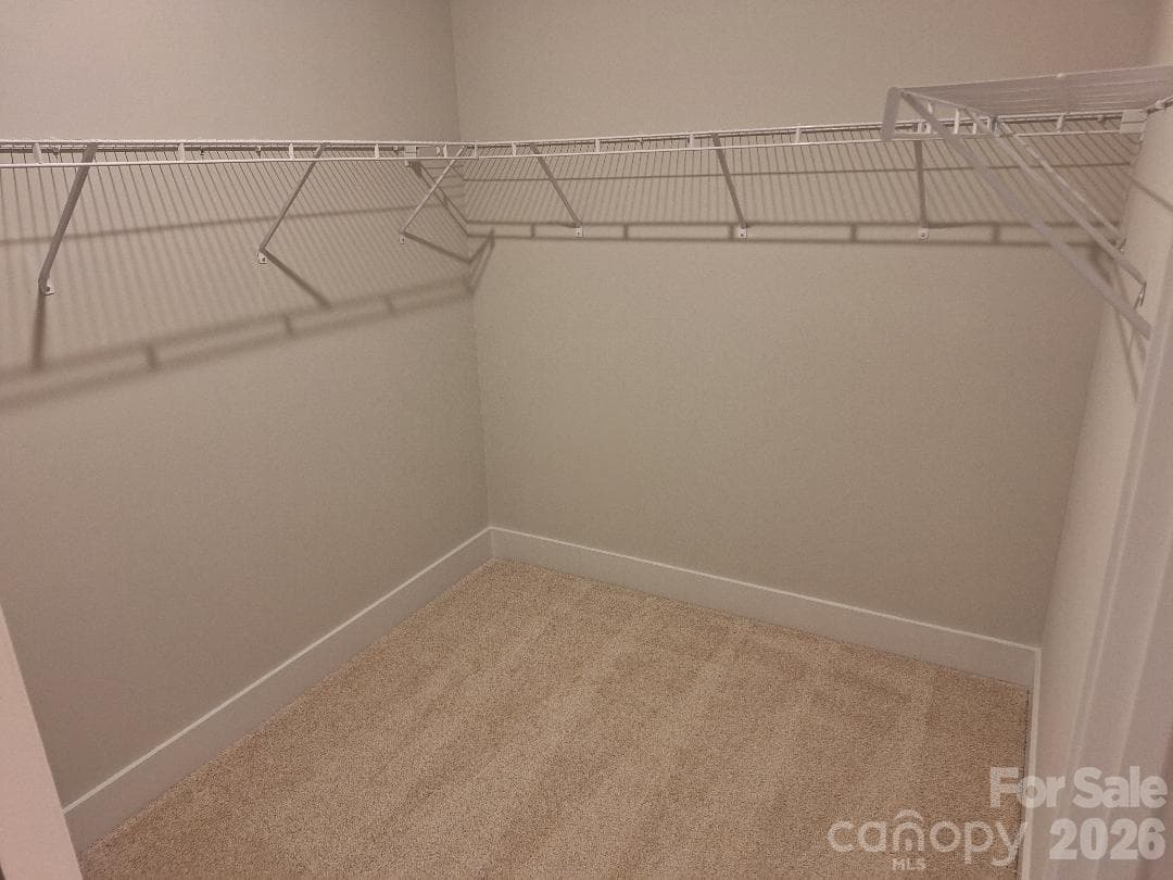 Primary Bedroom Walk-In Closet - 140 Kerr Walk Drive, Statesville