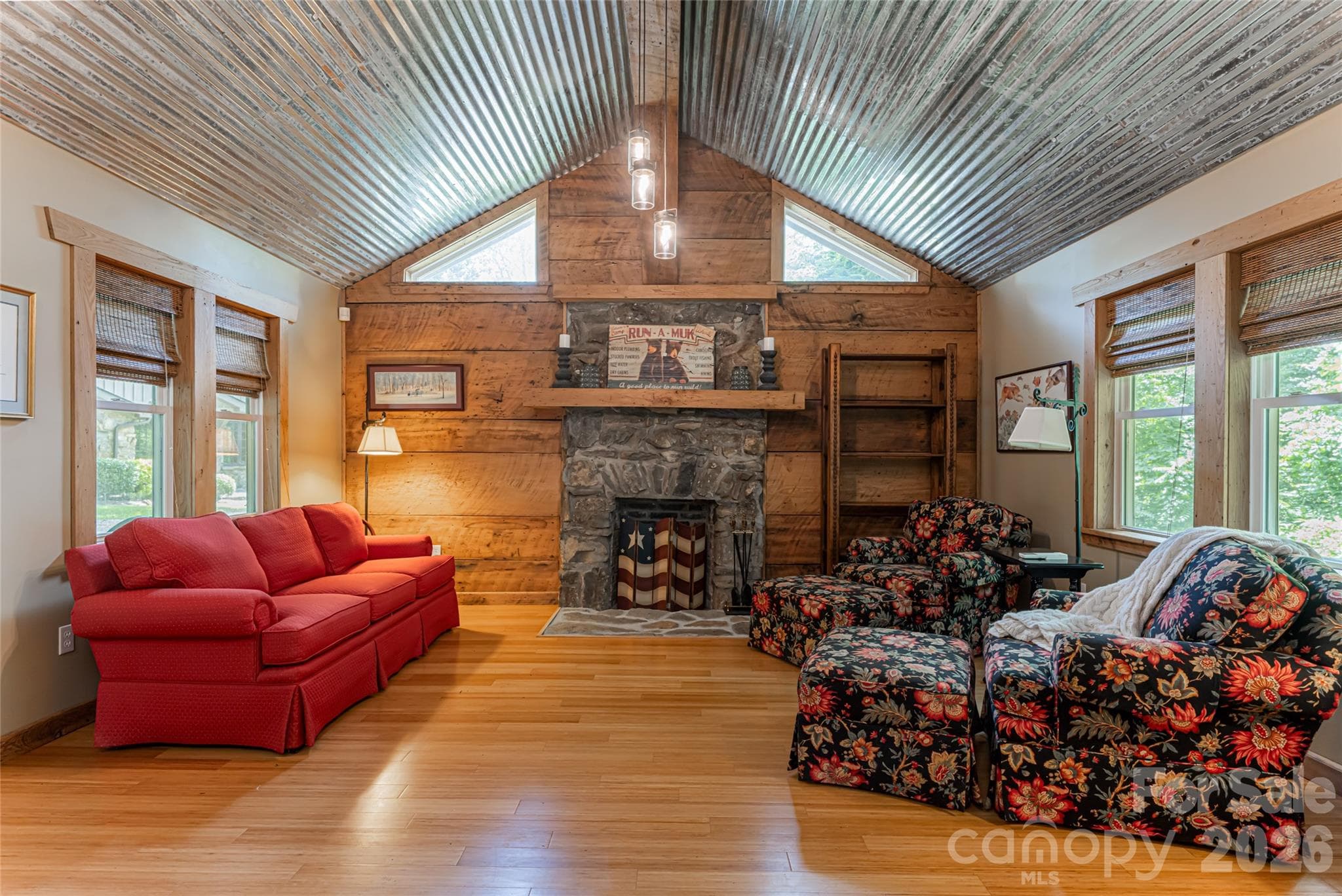 Guest Cottage with a stone fireplace.  All Trim and accent walls are wormy chestnut - Asheville