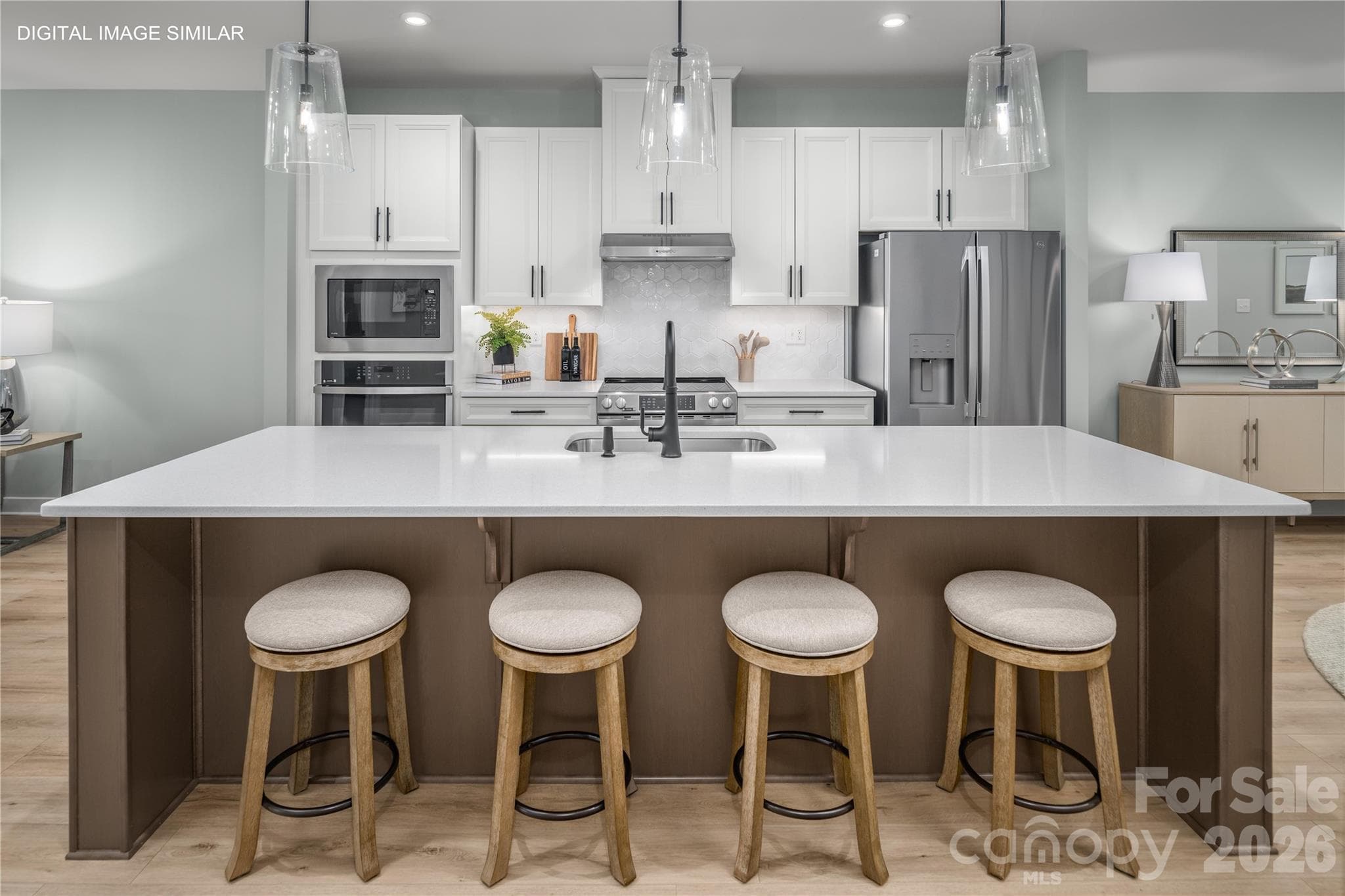 Oversized island with plenty of seating, perfect for gathering and everyday living. - 11161 Emerson Landing Drive, Charlotte