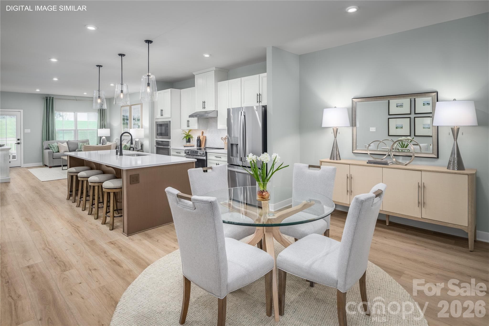 Open kitchen and dining space that flows easily for meals, hosting, and daily life. - 11161 Emerson Landing Drive, Charlotte