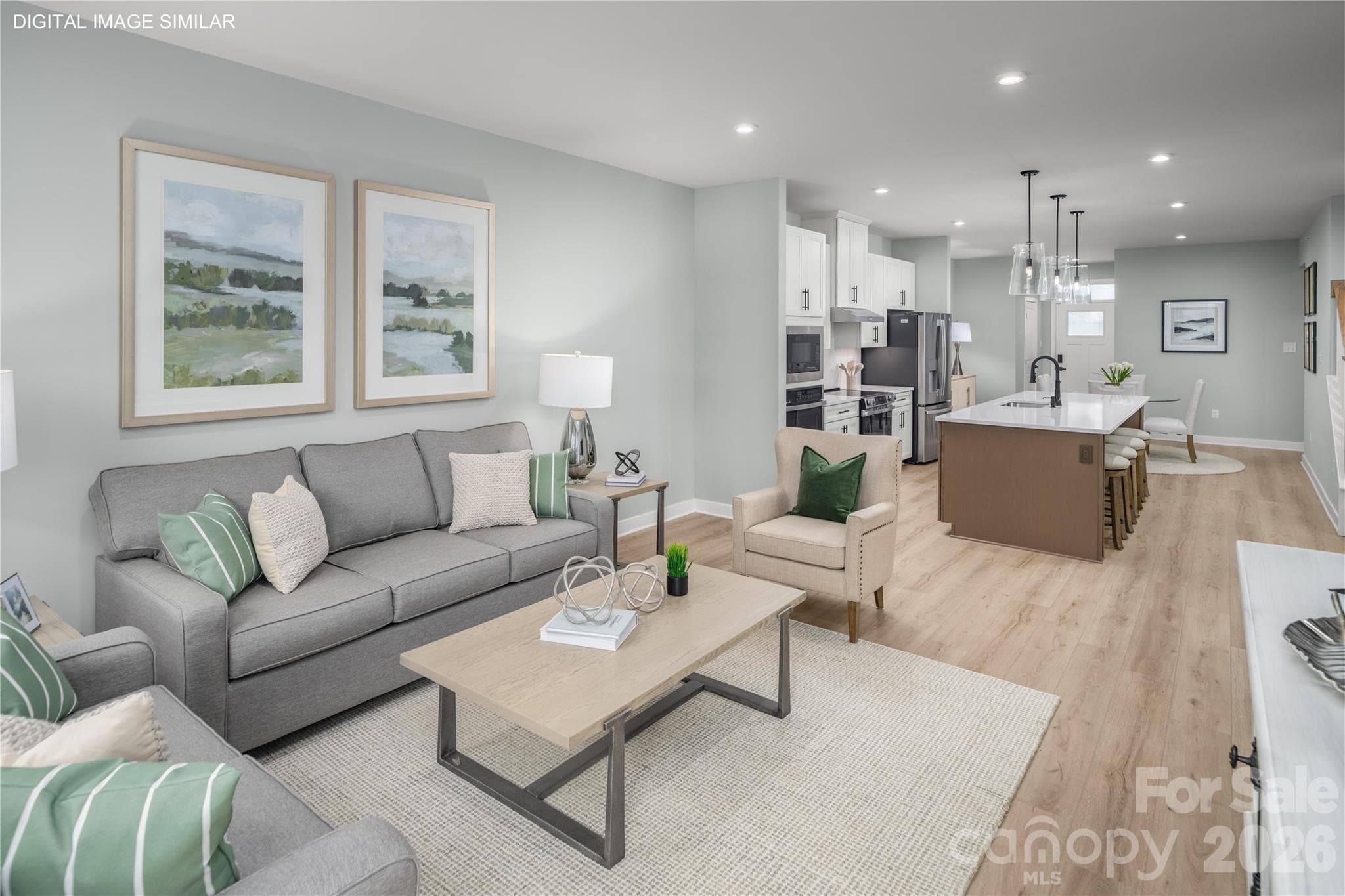 Living space that flows effortlessly into the kitchen—perfect for relaxing or gathering. - 11161 Emerson Landing Drive, Charlotte