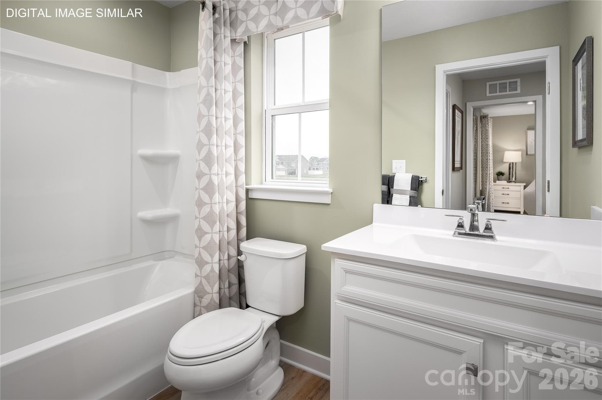 Inviting upstairs full bath with tub/shower combo—designed for both comfort and convenience. - 11161 Emerson Landing Drive, Charlotte