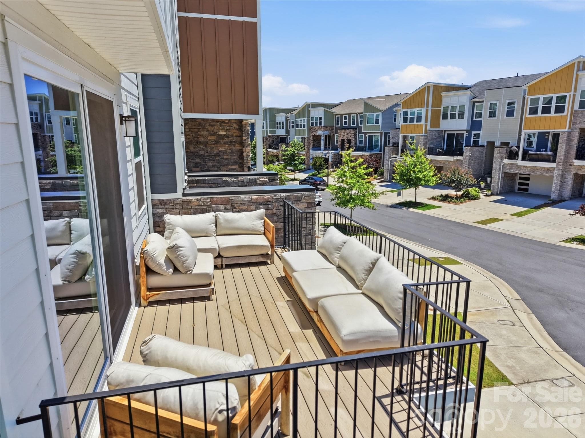 This massive front balcony is a whole vibe and perfect retreat for soaking up some sun or a kick back with friends - 3324 Treble Court, Charlotte