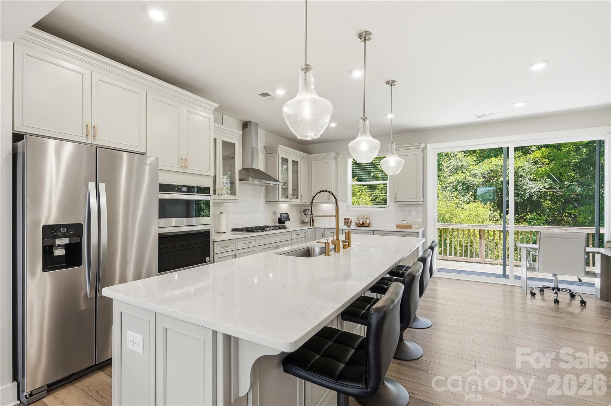 Stunning modern kitchen with upgraded Whirlpool appliances and a massive island is the chef's kiss! - 3324 Treble Court, Charlotte