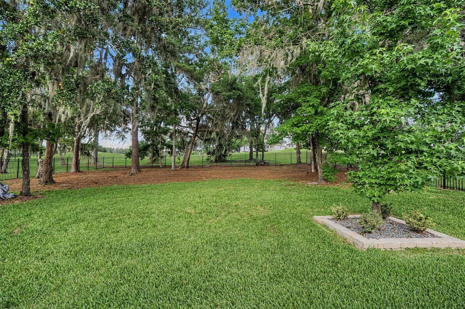 Lush, fenced backyard setting - 4926 SOUTHERN VALLEY LOOP, BROOKSVILLE