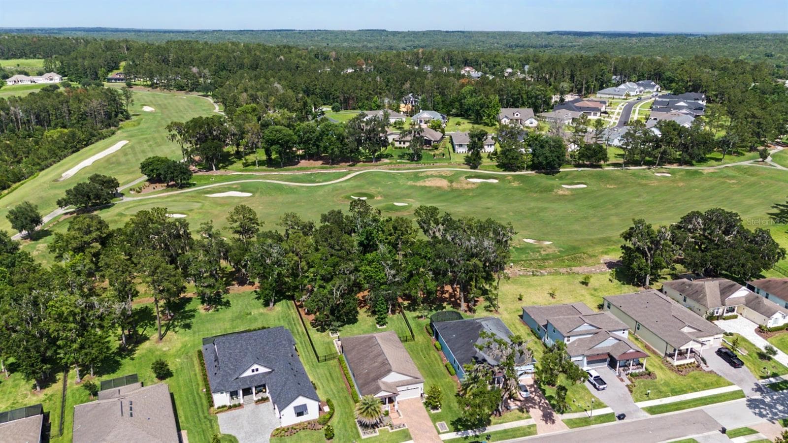 Golf course beyond the fenced backyard for serene views! - 4926 SOUTHERN VALLEY LOOP, BROOKSVILLE
