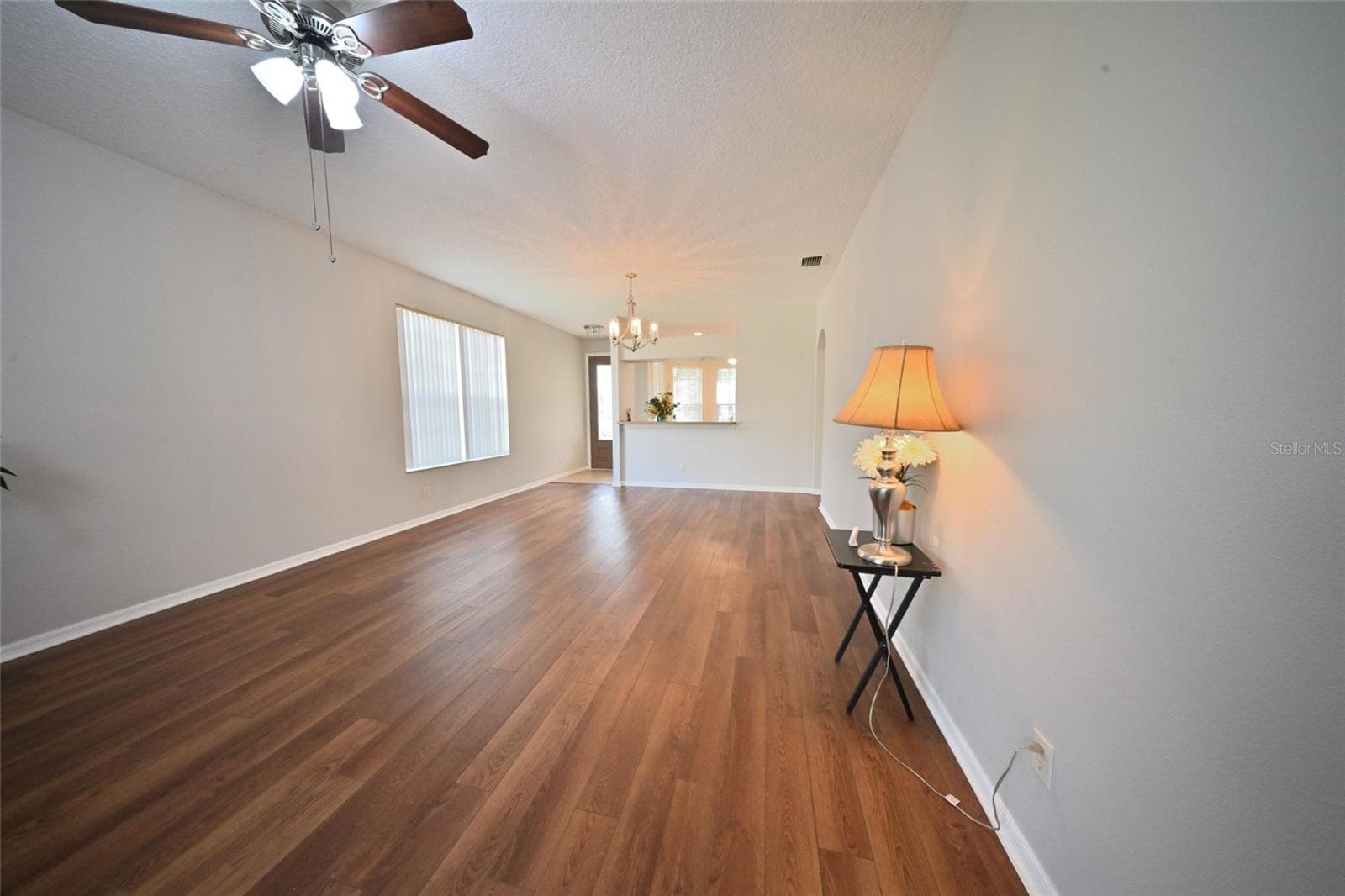 Family room taken with very wide lens. - 27326 ORCHID GLADE ST, LEESBURG