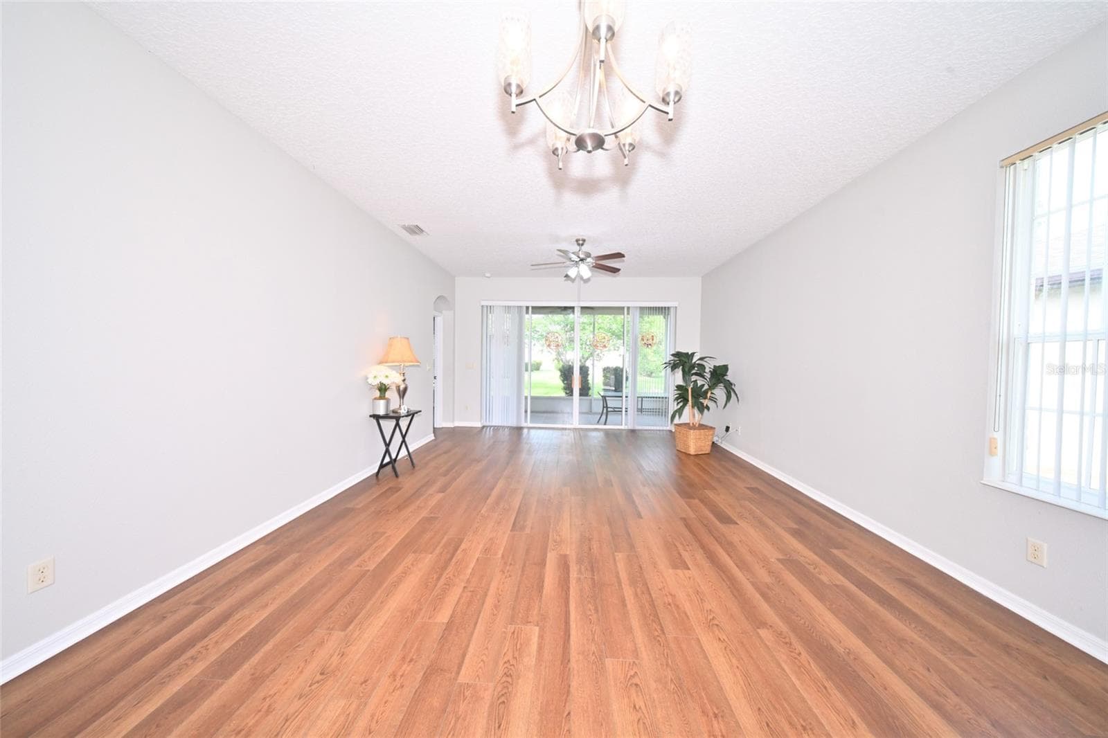 Family room taken with very wide lens. - 27326 ORCHID GLADE ST, LEESBURG