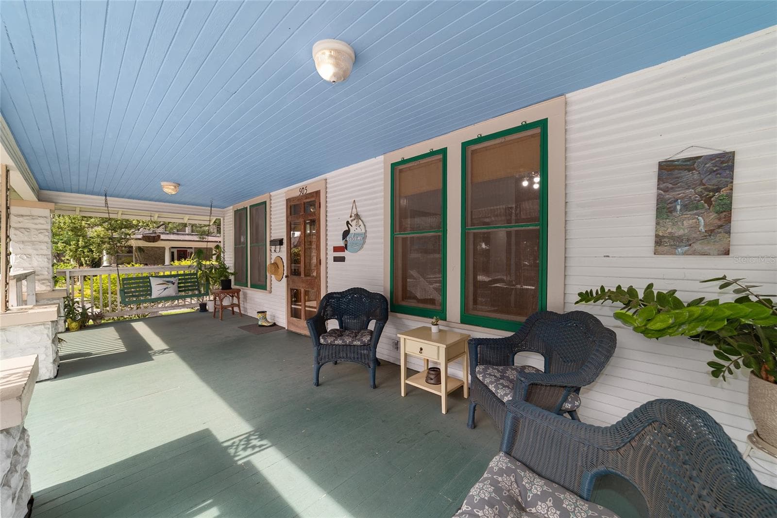 Spacious front porch - perfect for morning coffee and gatherings. - 505 SE SANCHEZ AVE, OCALA