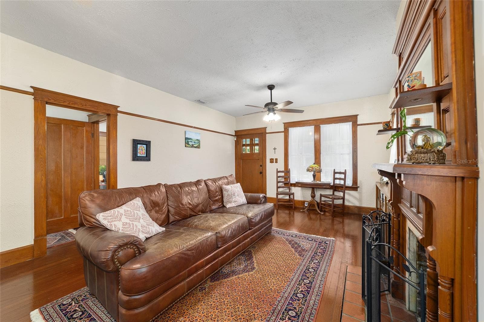 Craftsmanship abounds with original trim moldings, doors, hardwood floors, and fireplace. - 505 SE SANCHEZ AVE, OCALA