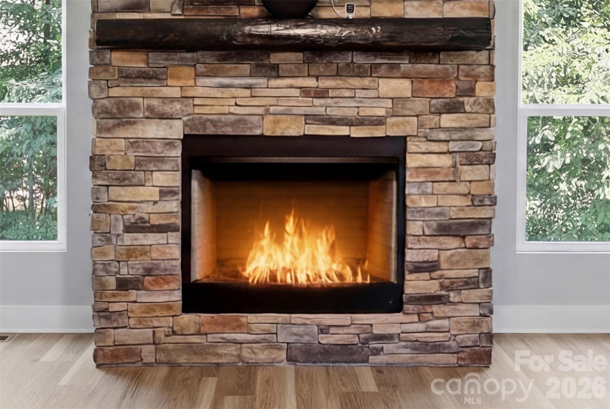 Stone veneer fireplace accents the great room as a centerpiece. - Rock Hill