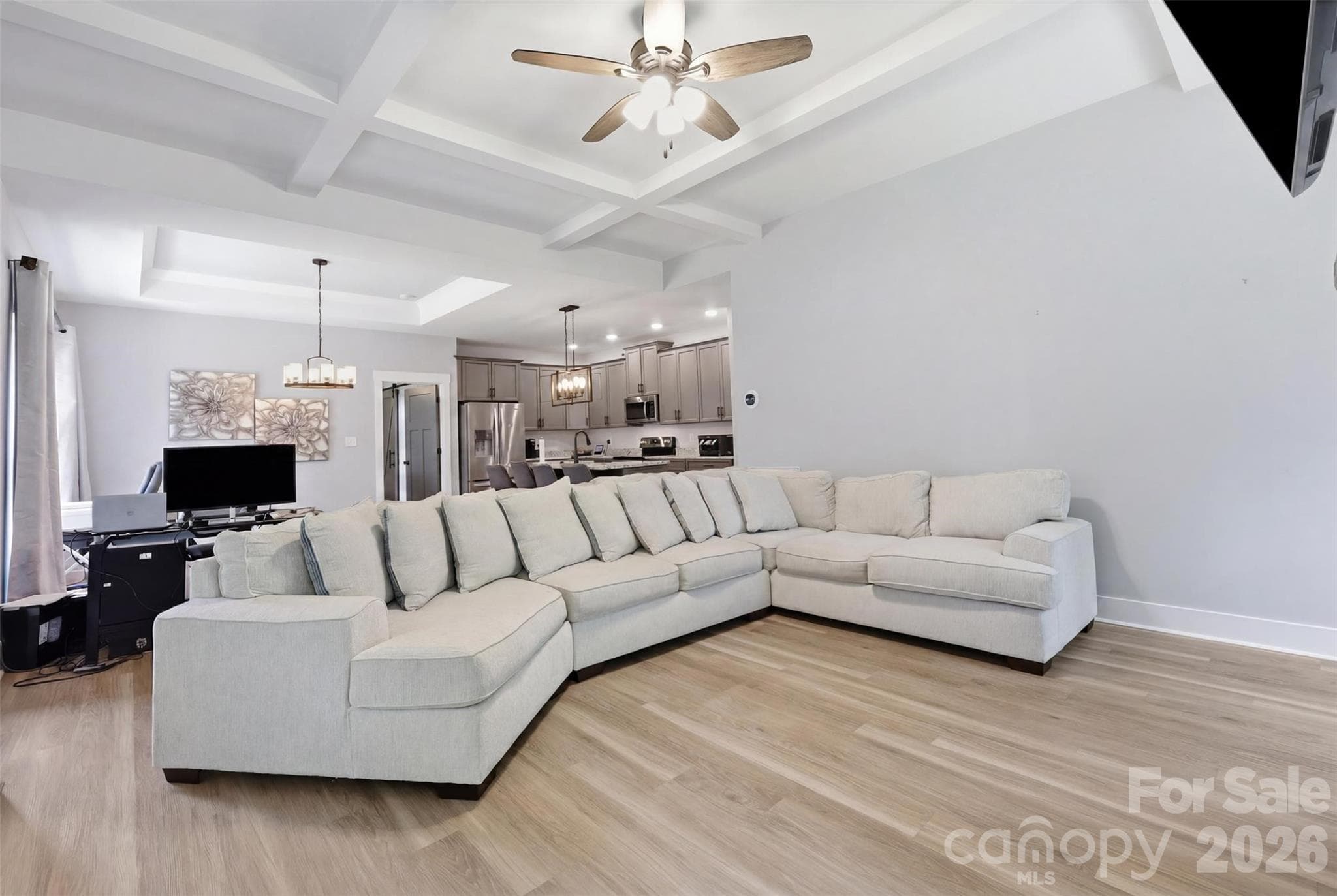 Custom millwork. The coffered and tray ceiling add true architectural personality to the open floorplan. 9-foot ceilings span the first floor. - Rock Hill