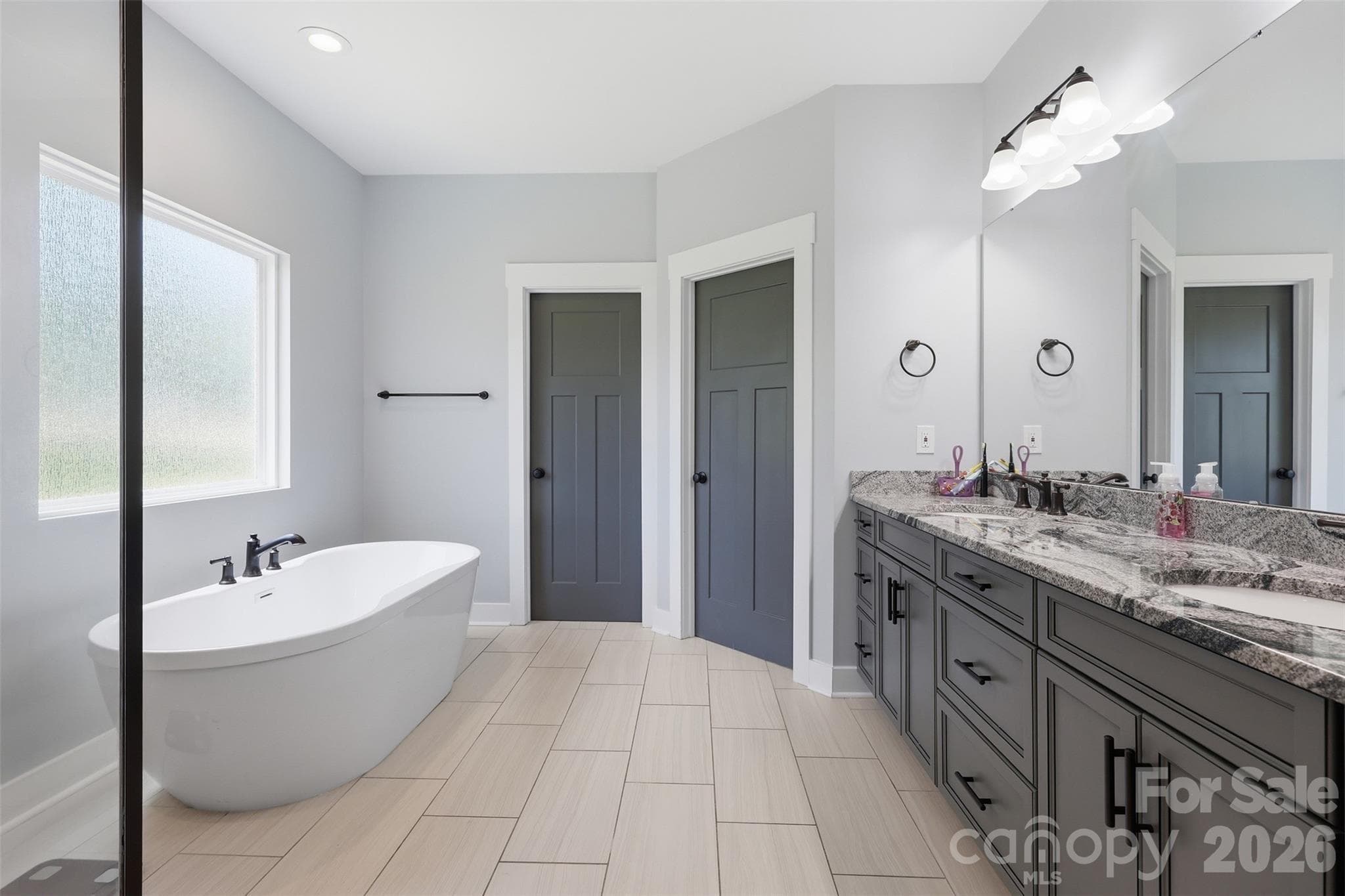 Very spacious primary bathroom with his and her sinks and walk-in closets - Rock Hill