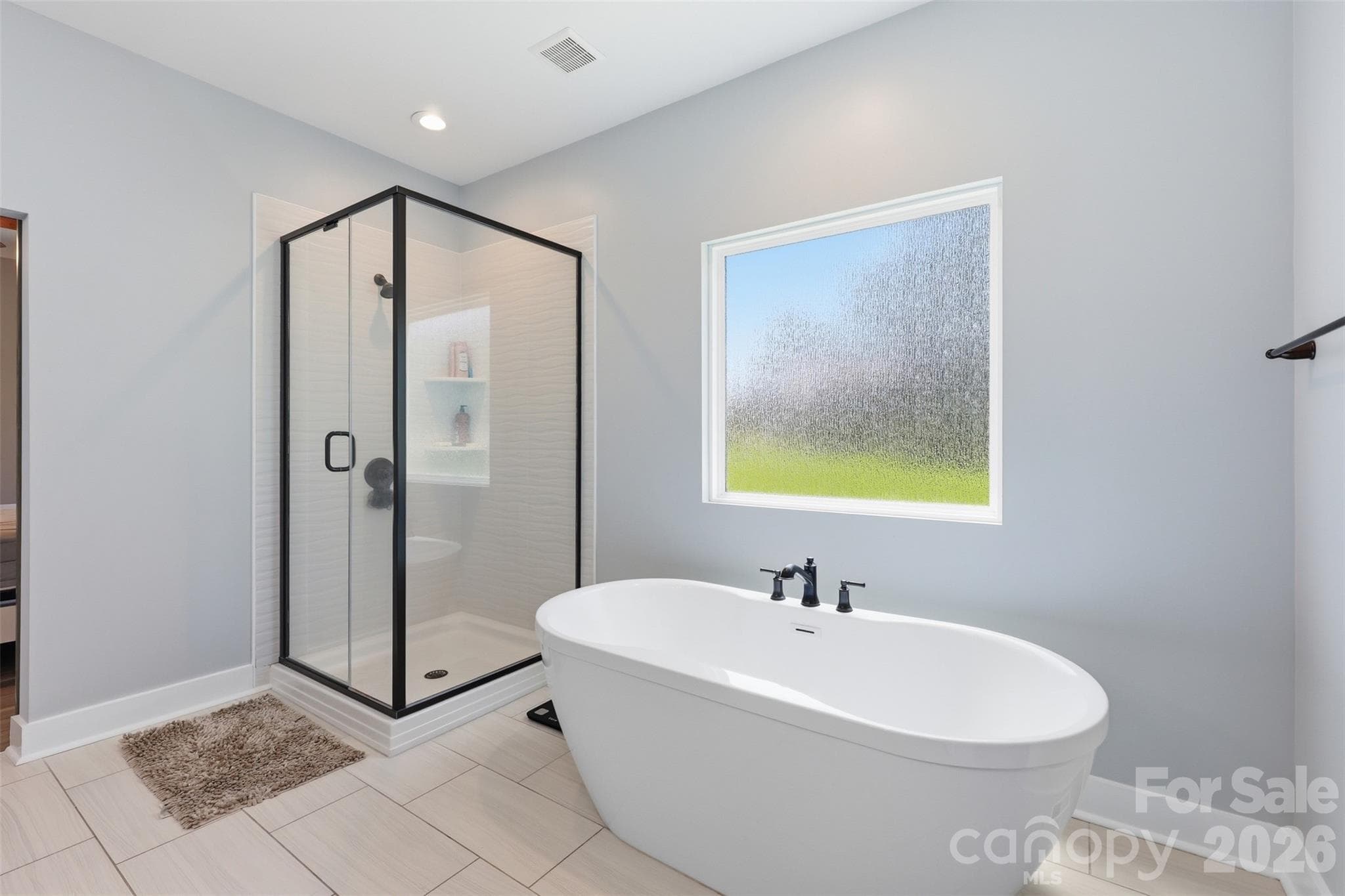 Standalone shower and tub in the primary bathroom - Rock Hill